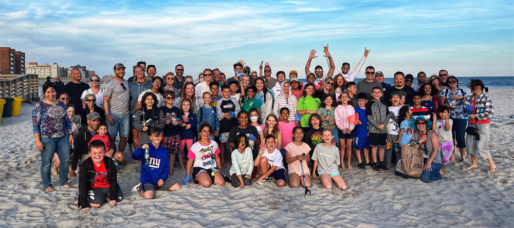 Community volunteers cleaning the Long Beach shoreline